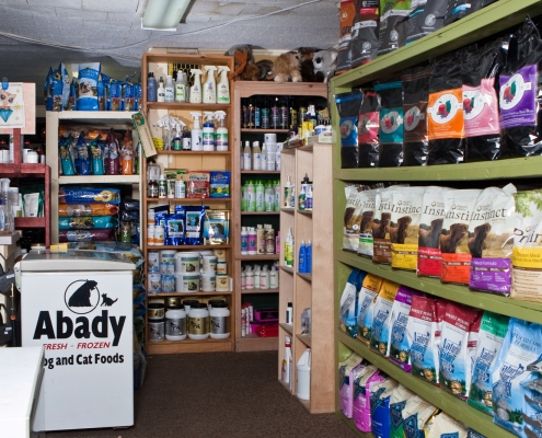 Shelves filled with pet food and supplies